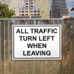 All Traffic Turn Left When Leaving Sign