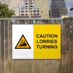 Caution Lorries Turning Sign