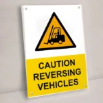 Caution Reversing Vehicles Sign