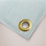 Construction Site Banners: Close up of a brass eyelet in a mesh site banner