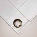 Backdrop Banners: Close up of a PVC banner hem and metal eyelet