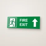 Fire Exit Running Man Right Arrow Up (HTM 65) Sign