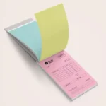 NCR Pads: Open NCR invoice pad showing the carbonless copies