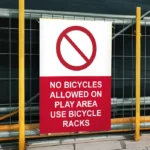 No Bicycles Allowed on Play Area Use Bicycle Racks Sign