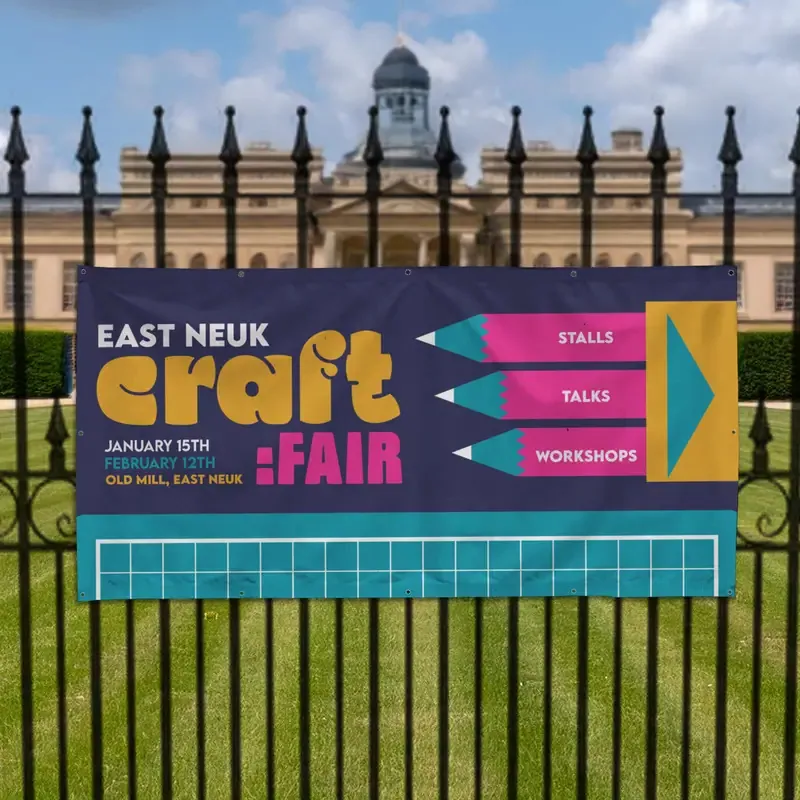 Craft fair banner tied to park railings (print help centre)