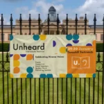Indoor Banners: Printed festival banner on railings in front of a historic building