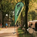 Teardrop Flags: Printed teardrop flag on a woodland path